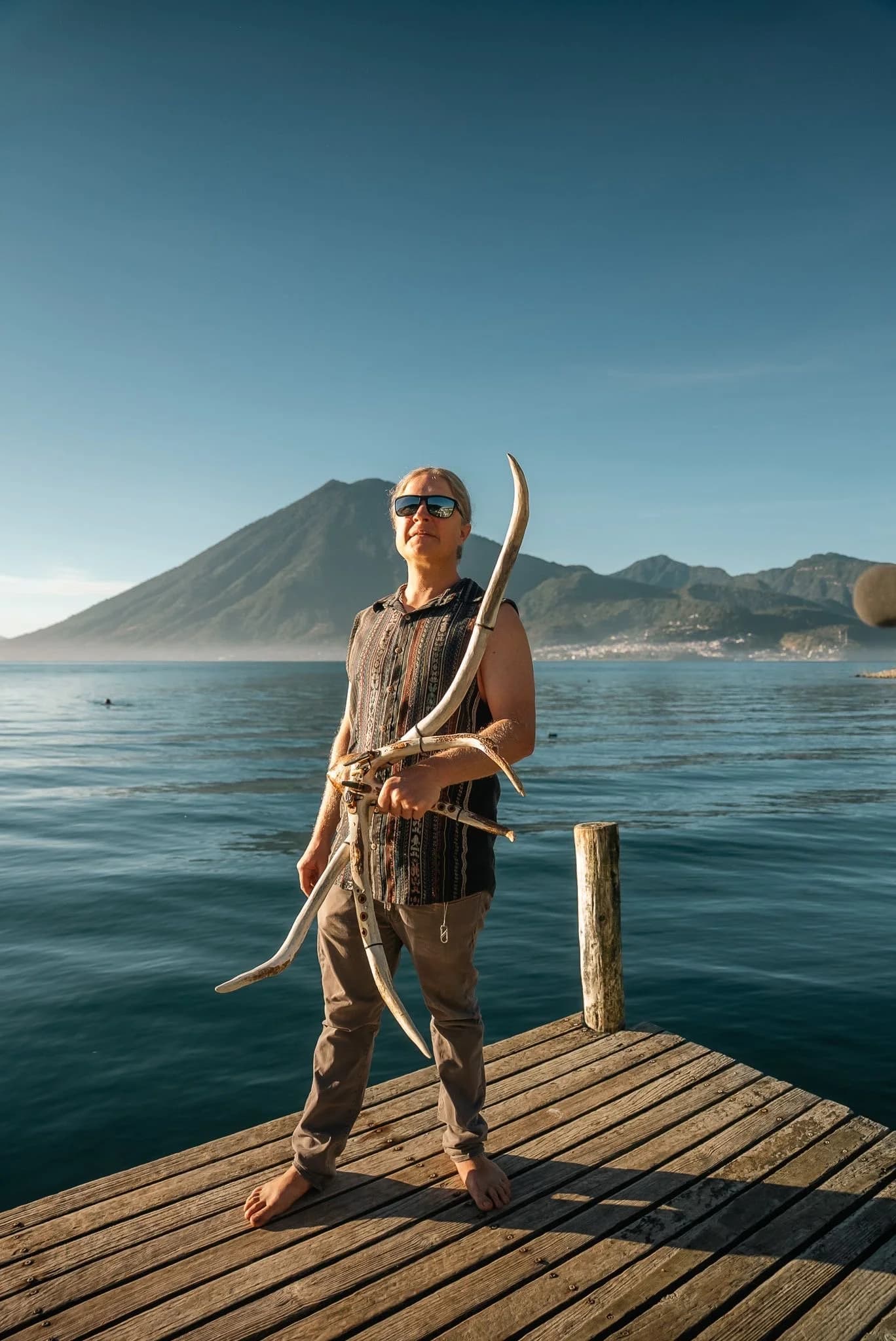 RootFlute on the pier with volcano in background