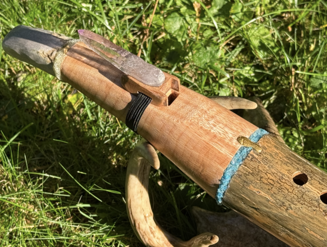Crystal mouthpiece and carved wood — craftsmanship detail